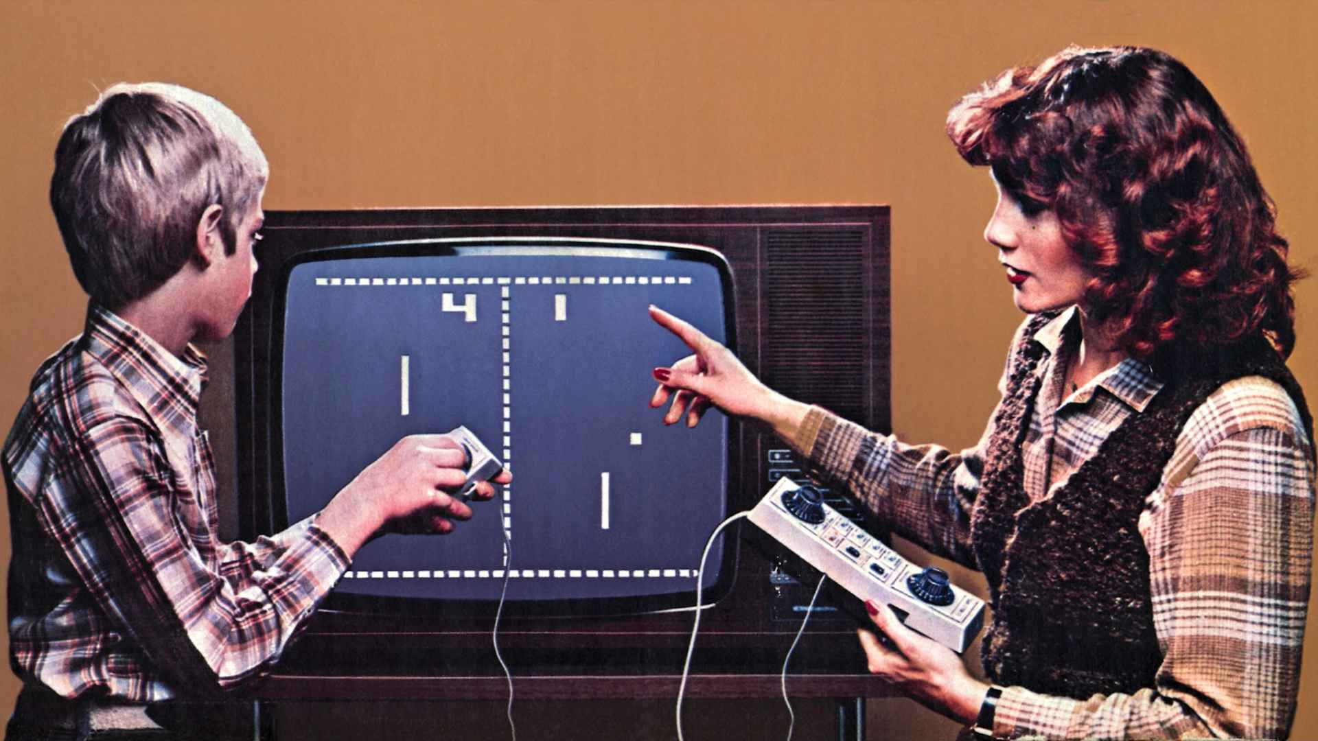 First video game 'Pong," mother with son, Germany, circa 1976
