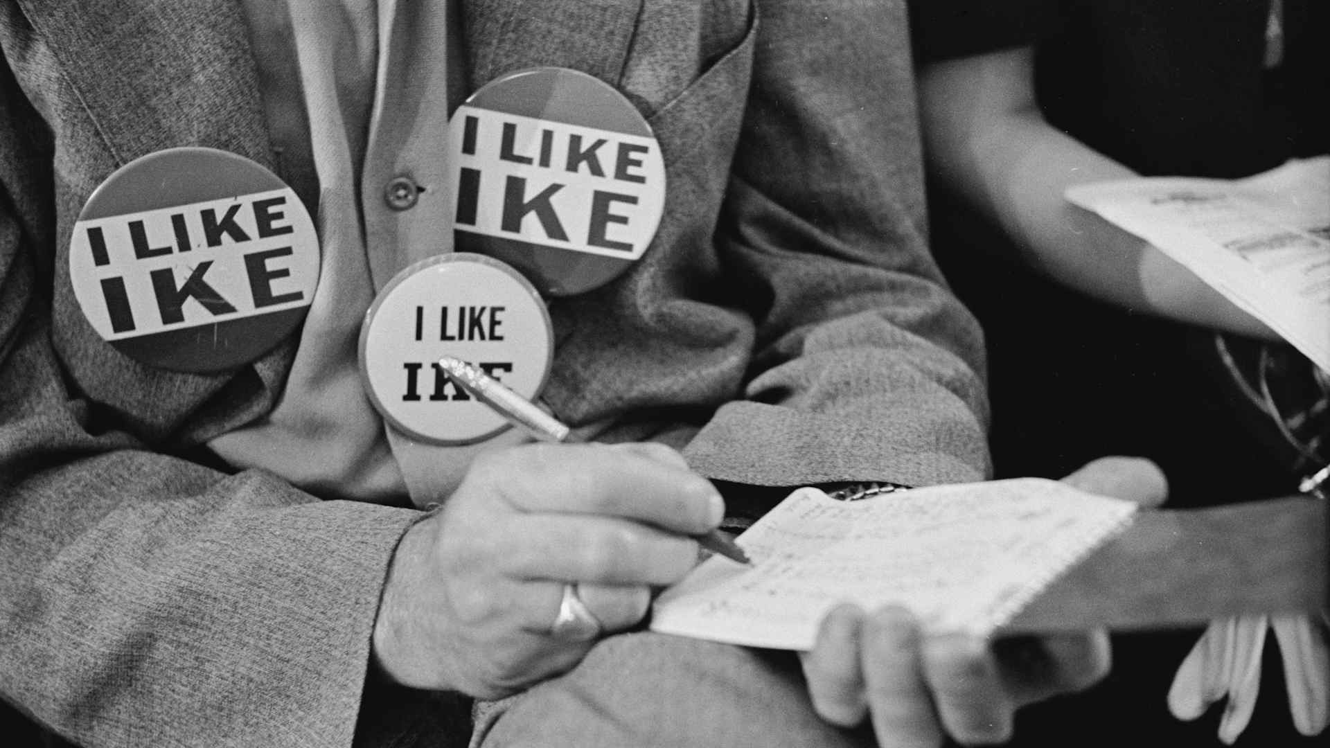 A supporter of presidential candidate Dwight D Eisenhower, aka Ike, wearing three 'I Like Ike' badges at the 1952 Republican National Convention in Chicago, Illinois, July 1952.
