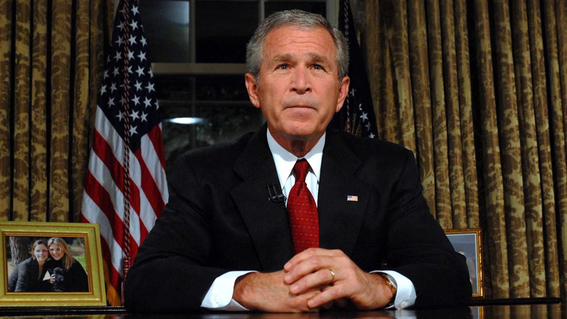U.S. President George W. Bush sits at his desk in the Oval Office of the White House after addressing the nation on the anniversary of the 2001 terrorist attacks September 11, 2006 in Washington, DC. It's been five years since terrorists seized four airliners in flight, crashing two in the World Trade Center in New York, one into the Pentagon in Arlington, Virginia and one into a field in Shanksville, Pennsylvania.