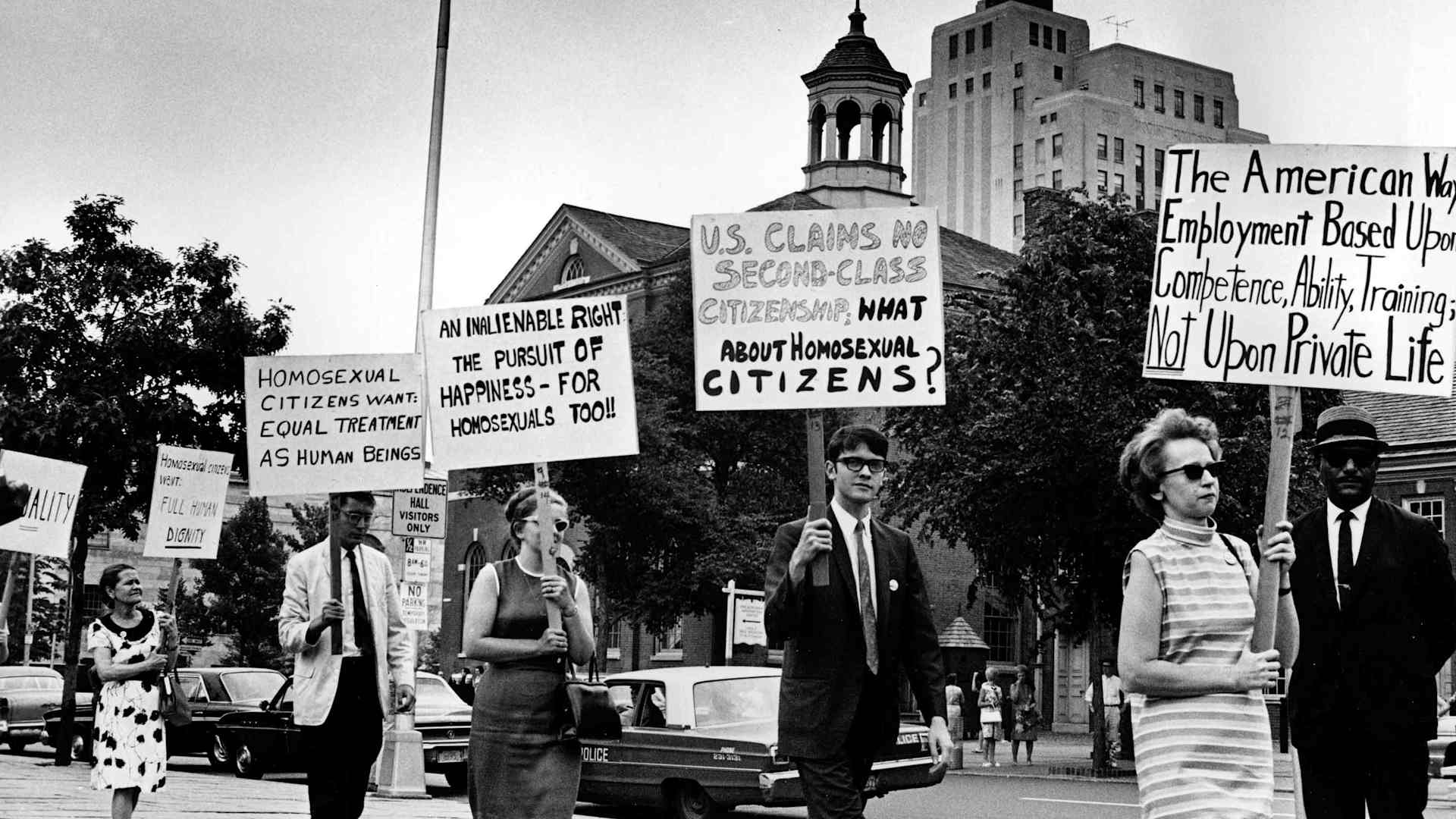 Demonstrators carry signs calling for protection of homosexuals from discrimination as they march in a picket line in front of Independence Hall in Philadelphia, 1967. (Credit: AP Photo)