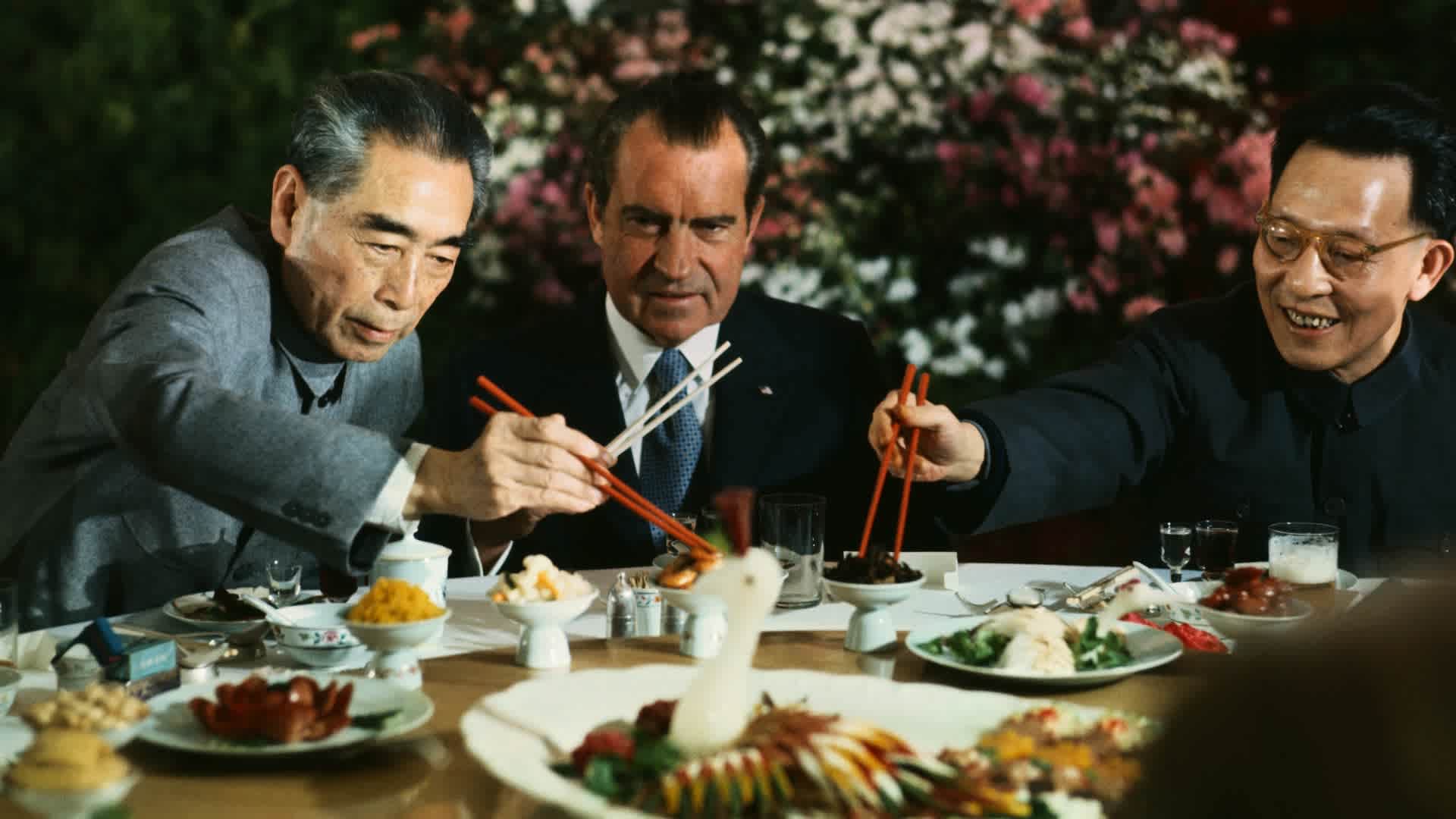 President Richard Nixon shares a meal with Premier Chou En-lai (left) and Shanghai Communist Party leader Chang Chun-chiao on February 27, 1972.