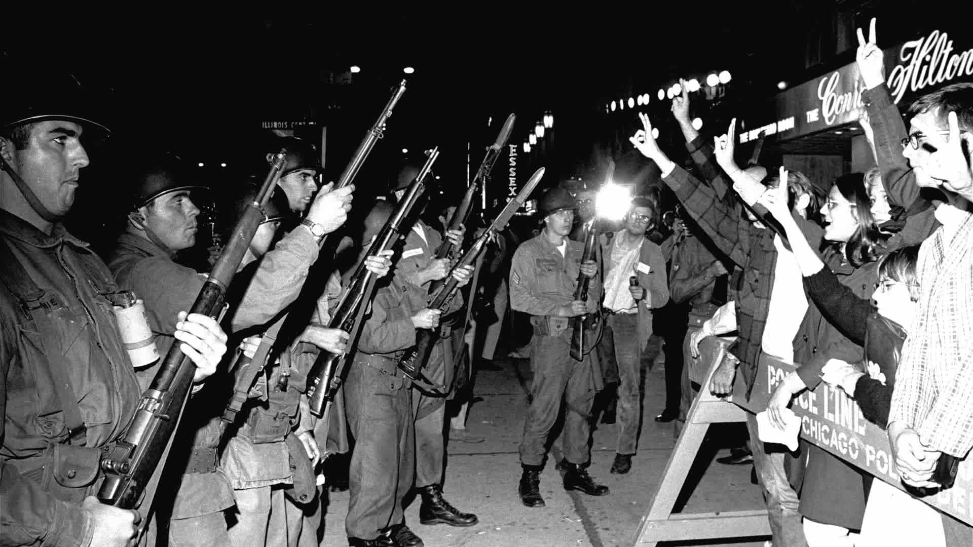 Peace demonstrators taunt Illinois National Guardsmen outside the Democratic National Convention headquarters hotel, on August 29, 1968. (Credit: AP Photo)
