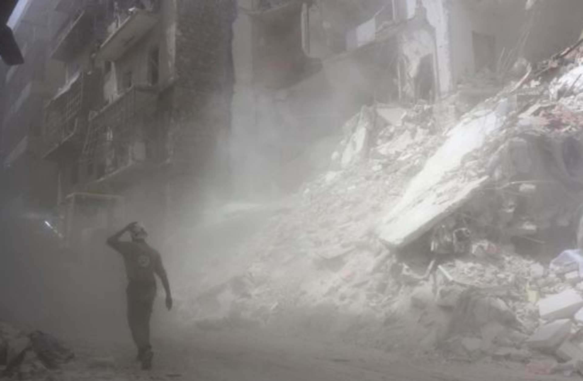 A member of the White Helmets in the rebel-held neighborhood of al-Kalasa in the northern city of Aleppo on June 3, 2016. (Credit: THAER MOHAMMED/AFP/Getty Images)
