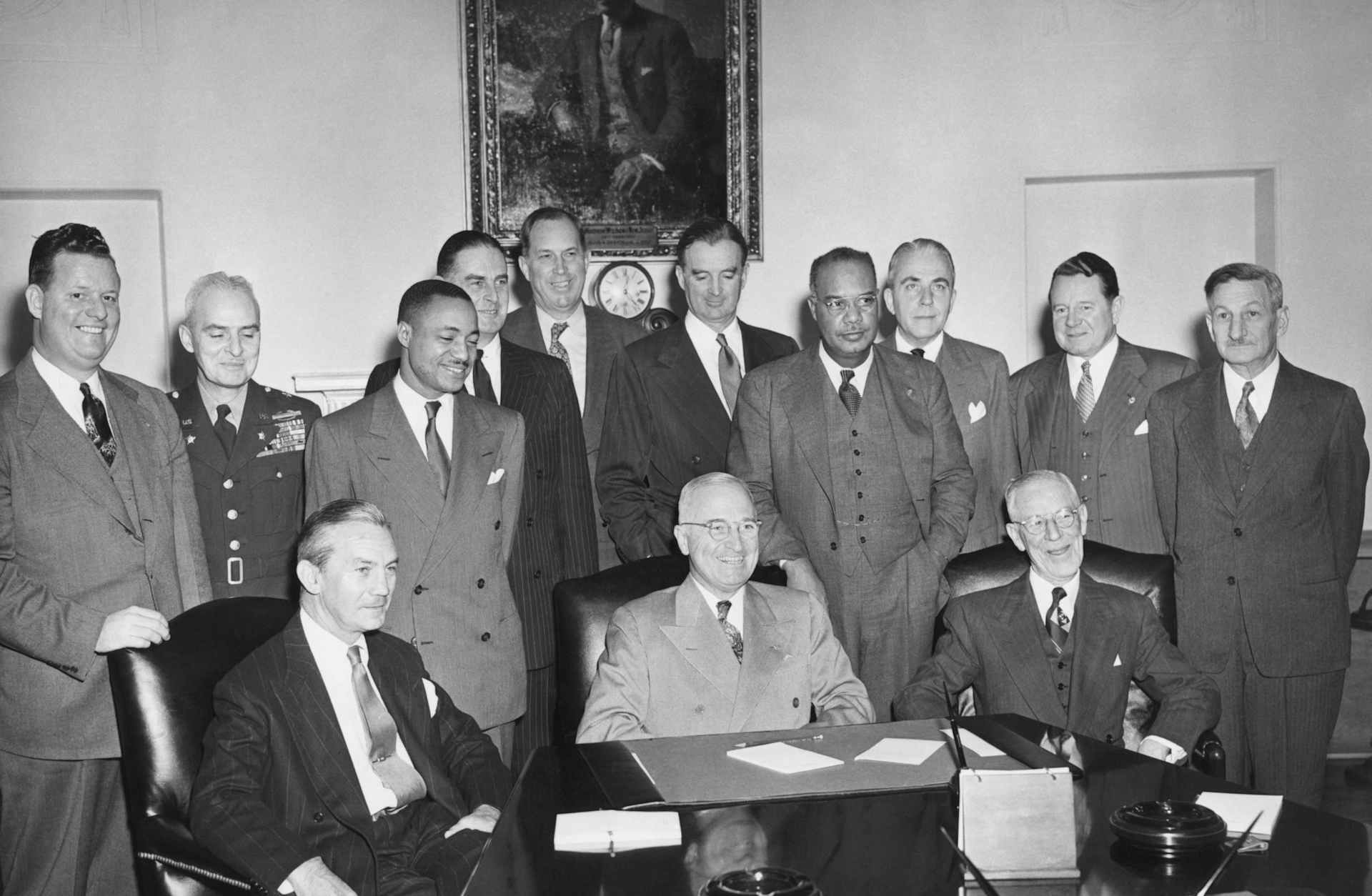 Pres. Truman seated with the Committee on Equality of Treatment and Opportunity, Jan. 12, 1949.