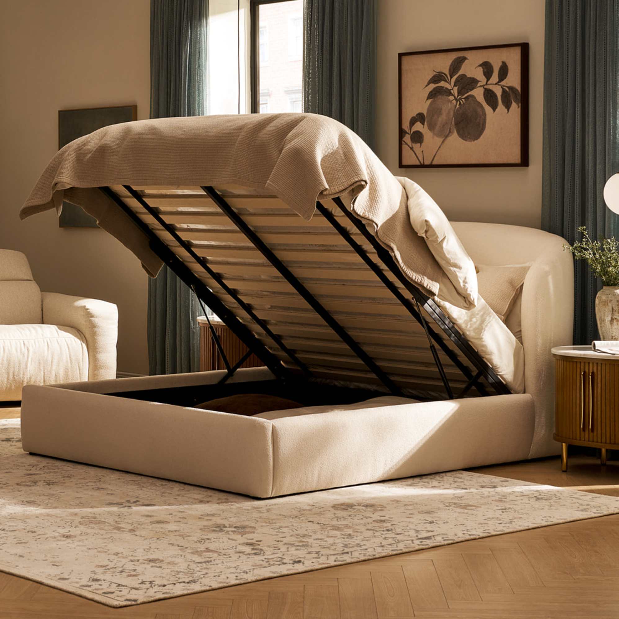 A hydraulic lift storage bed lifted up to reveal ample storage beneath.