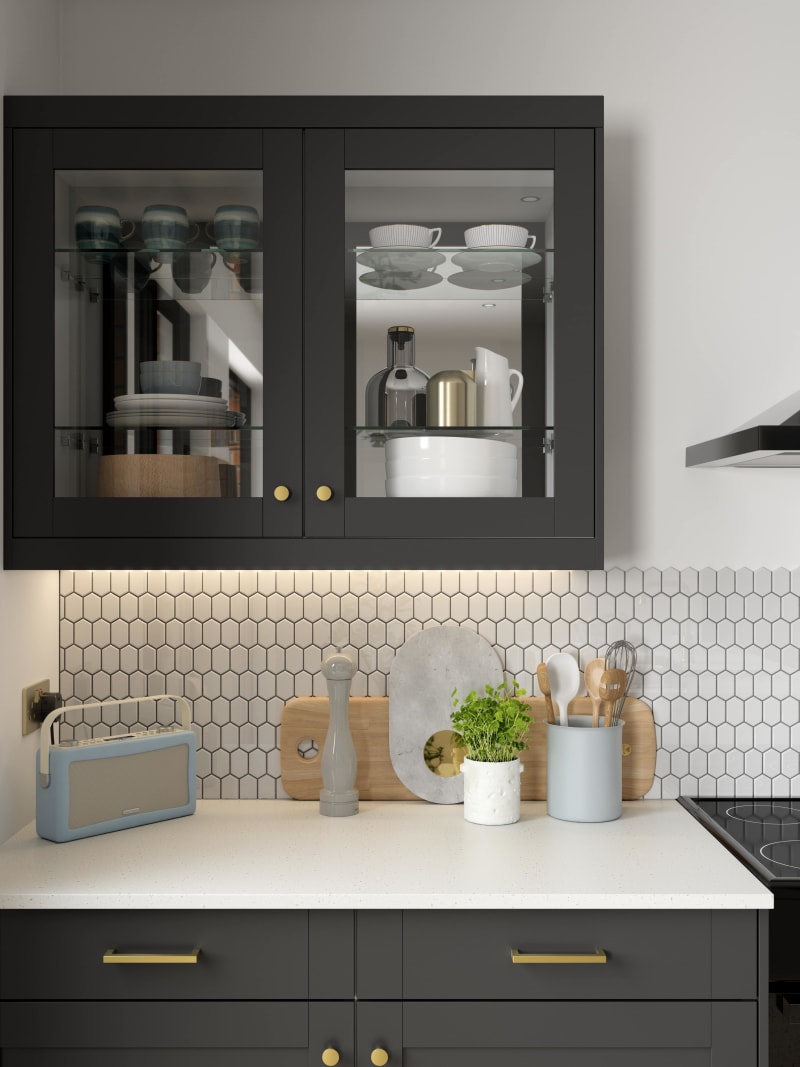 Close-up of framed glass front display cabinets Tatton Midnight kitchen from Magnet, a contemporary dark blue narrow frame shaker door.