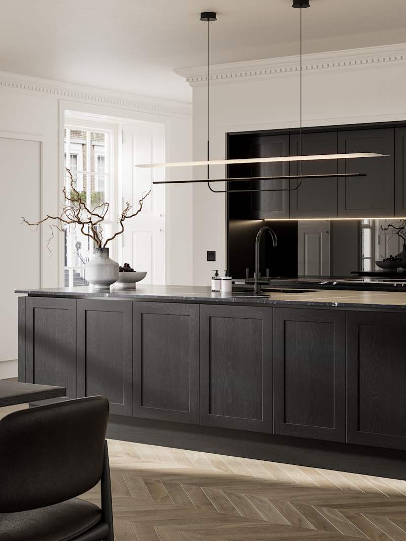 Handleless frame doors Integra Wardley Sumi black kitchen with kitchen island, Integra Soho Limestone tall cabinets with integrated ovens, black dining table and chairs, pale oak chevron flooring.