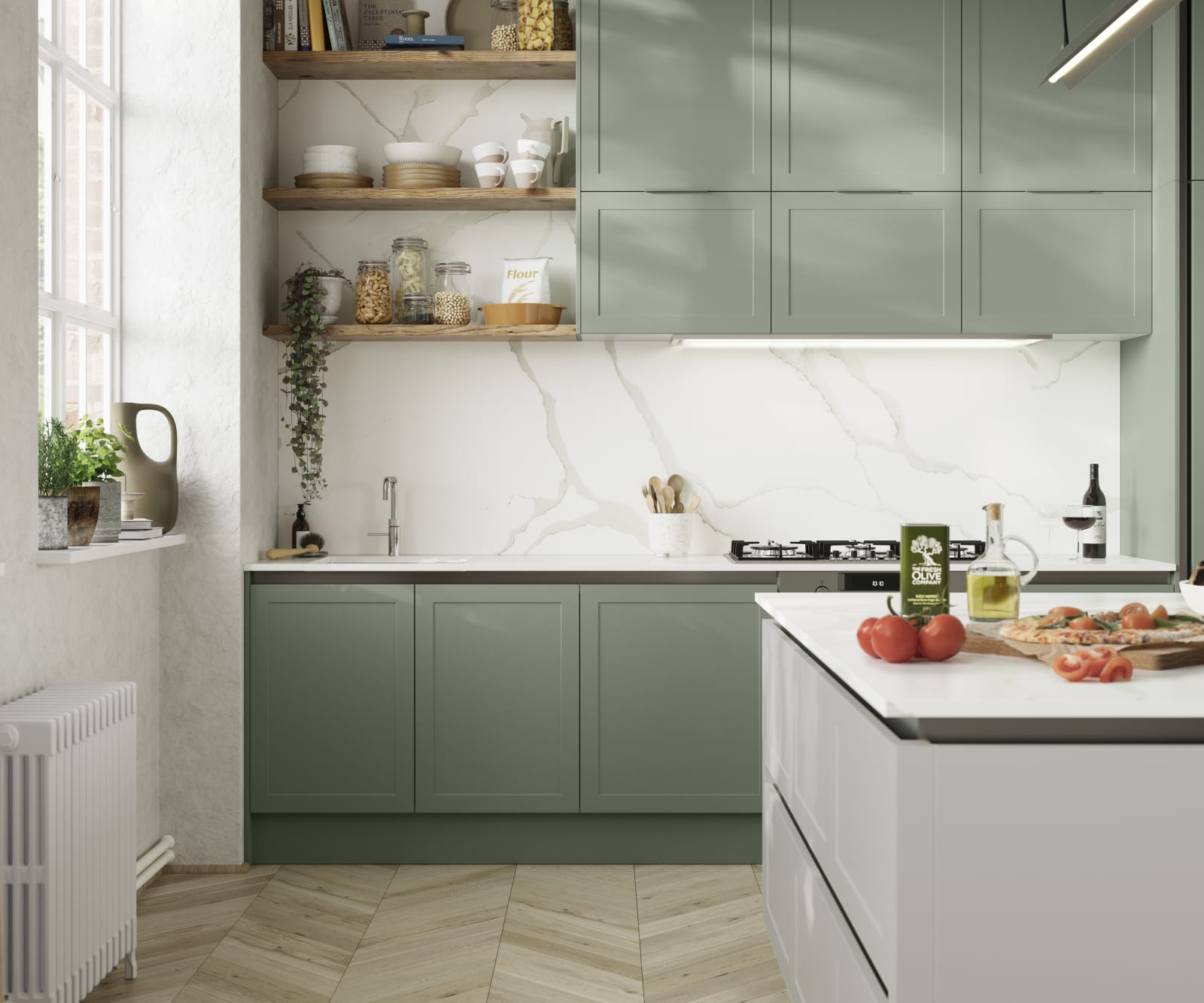 Integra Dunham from Magnet is a handleless shaker frontal, here shown in kitchen with kitchen island and wall cabinets in shades Eucalyptus and Washed Cotton, with a white marbled worktop and matching splashback with wood open wall shelves..