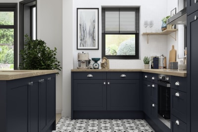 Tatton Midnight kitchen from Magnet, a contemporary dark blue narrow frame shaker door, with a patterned tile floor.