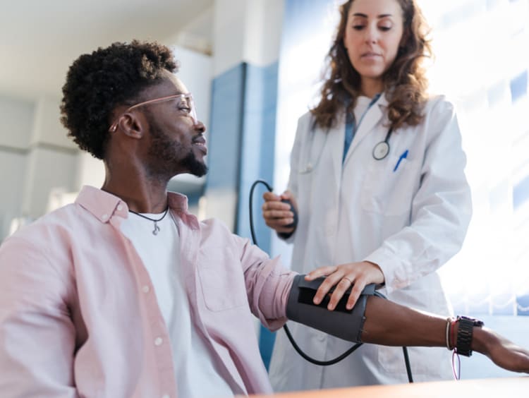 Portrait of a man receiving medical care while smiling - stock photo