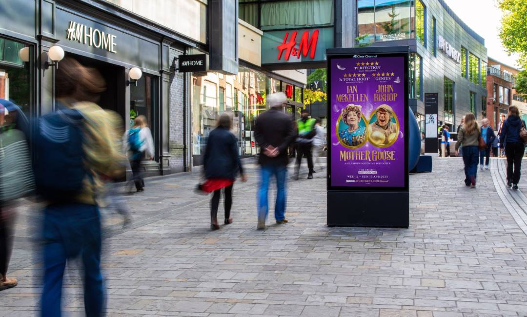 Bristol Hippodrome advertising a theatre show on a digital screen outside of H&M