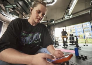 Peloton member choosing a class to cool down after a workout